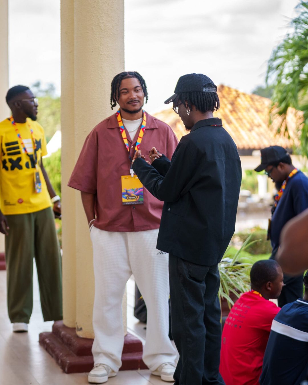 dEX Design Conference 2025 — attendees talking on the venue terrace