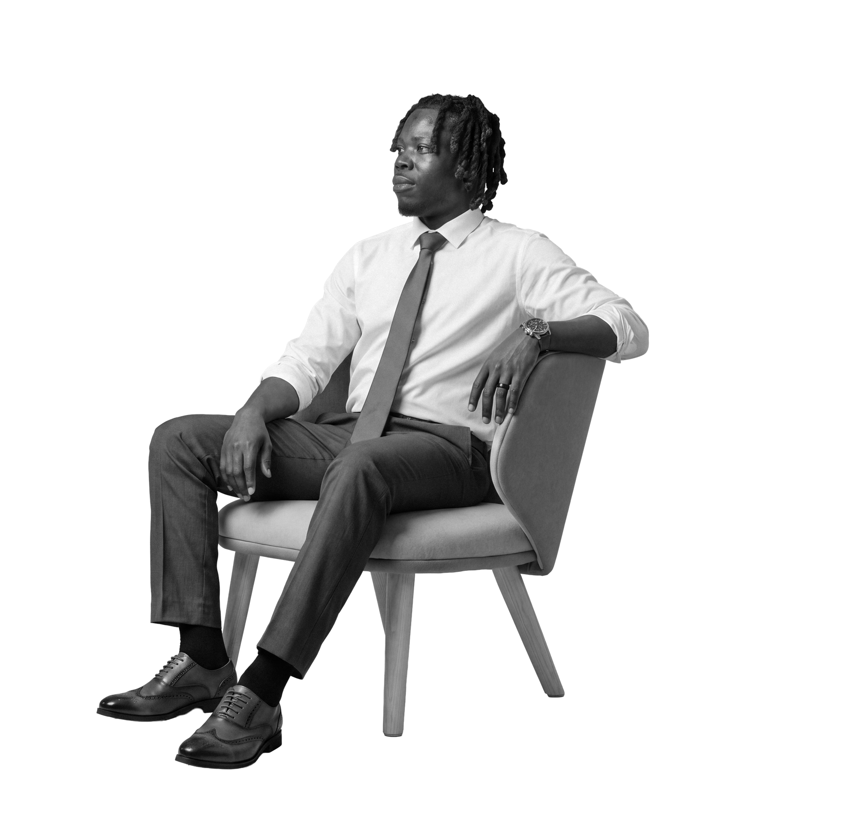 Nicholas Adusei Agblevor seated in a chair